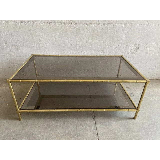 French Faux Bamboo, Mirrored Brass & Smoked Glass Two-Tier Coffee Table by Maison Baguès, 1960s, in Good conditions....