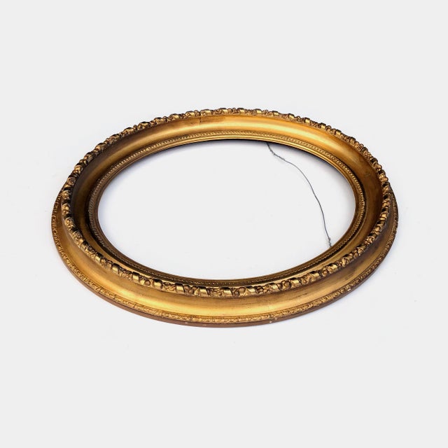 This antique oval gold frame is in good condition with some chips as pictured. Fits 16.75 x 20.75 inch artwork. Outer...