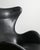 A very rare and beautiful example of an iconic danish mid century "3317 / egg" armchair in original black patinated...