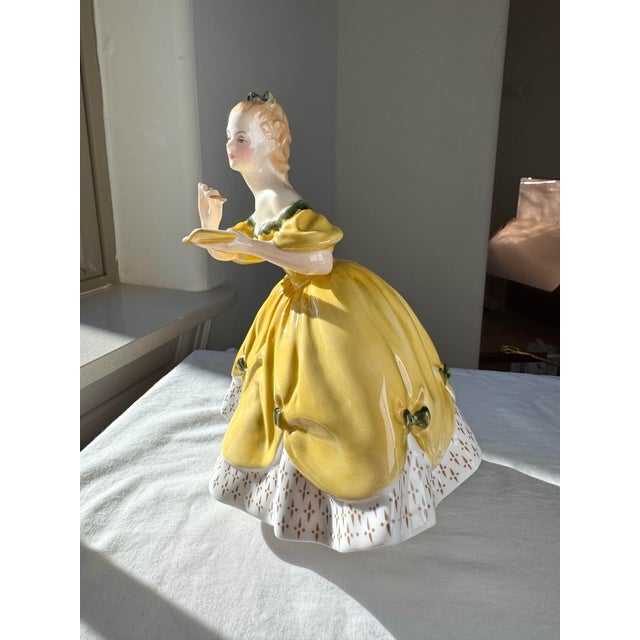 “The Last Waltz” (H.N. 2315), introduced by Royal Doulton in 1959, is a finely modeled bone china figurine from the H.N....