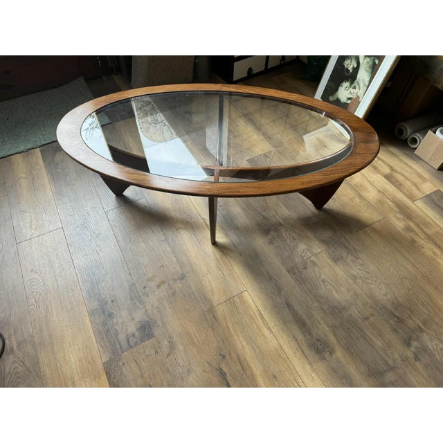Restored Oval teak "Astro" coffee table with glass top produced by G-Plan in England, circa 1960s. 41 cmHx122 cmWx66 cmD...