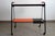 Vintage rolling serving cart in perforated metal and painted Formica, circa 1950. Very slight signs of wear on the base....