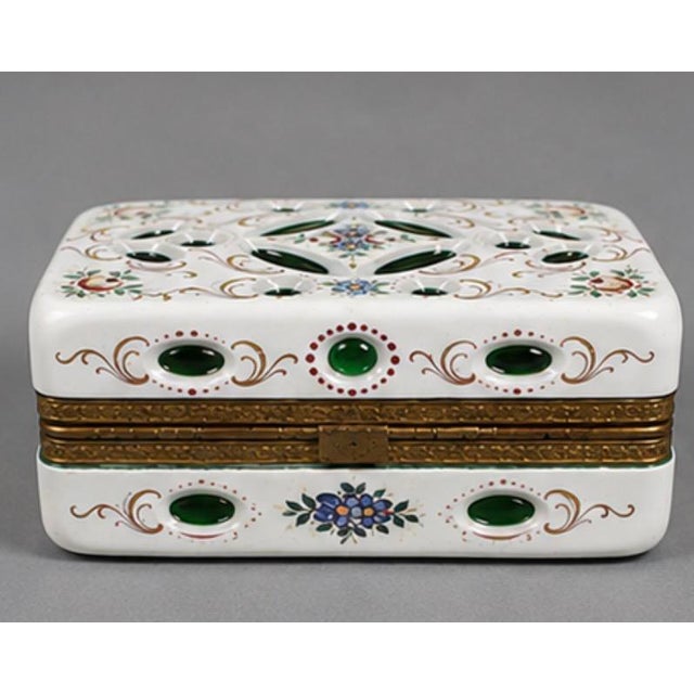 A beautiful rectangular opaline overlay jewelry box dating from the 19th century. The casket is formed from white opaline...