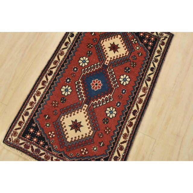 An authentic vintage tribal Yalameh rug hand-knotted with fine wool and natural dyes. This nomadic rug features geometric...