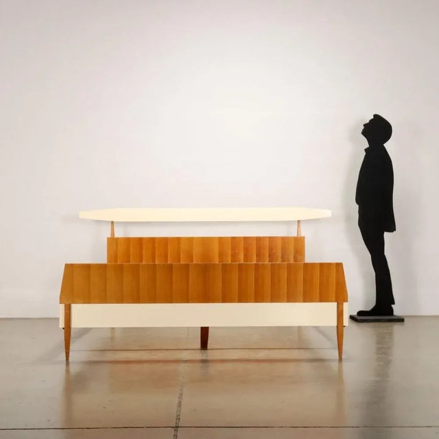 Double bed in mahogany and formica veneered wood; a bed to be customized by replacing the formica, with a color that makes...