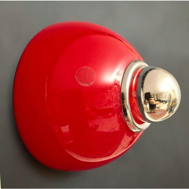 Vintage Italian flush mount or wall light with a single glossy red Murano glass shade / Made in Italy by Vistosi, circa...