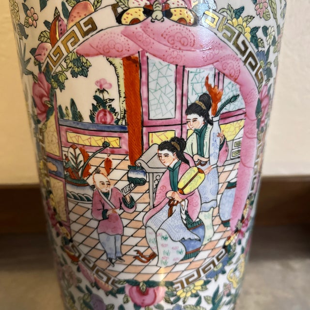 Lovely multicolored (with heavy pink and golds) vintage Chinoiserie porcelain umbrella stand. Marked on bottom made in...