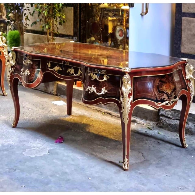 Make a bold statement with this large French Rococo-style executive desk, featuring a rich brown finish, elegant curved...