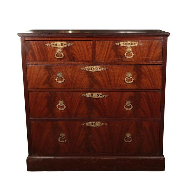 A handsome antique Mahogany Chest of Drawers (c. 1820-1840) in the Biedermeier style. Features superb Flame Mahogany...