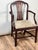 Elegant in both form and proportion, this antique English George III armchair dates to the early 19th century and reflects...
