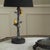 Functional decorative lamp with naturalistic bird figures on a textured polyresin base. Black fabric shade, E27 socket,...