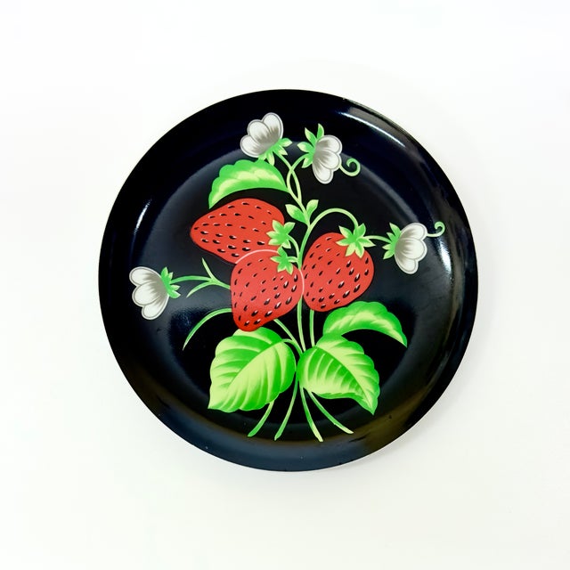 Strawberry motif black side plates, group of 6. This is an eclectic set of Mann side plates made in 1976 in the "Italian...