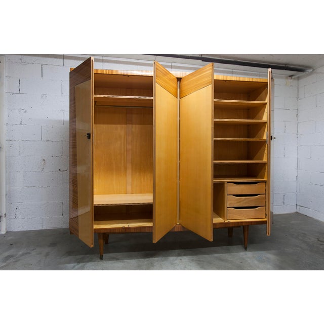 A unique 1960s Scandinavian wardrobe in light varnished wood. It has a distinctly 1960s design with its pointed shape and...