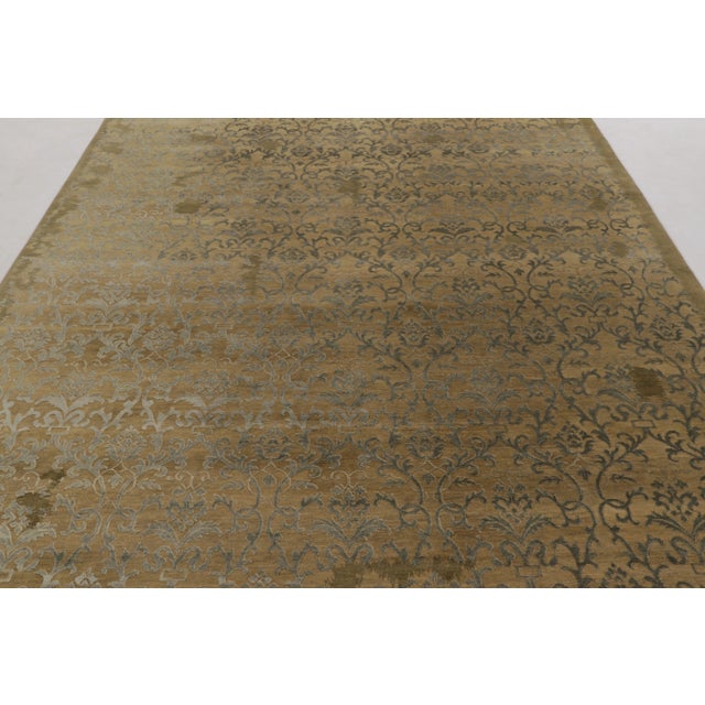 Hand-knotted in a fine blend of wool and silk, this 9x12 contemporary rug is a majestic addition to the Modern Classics...