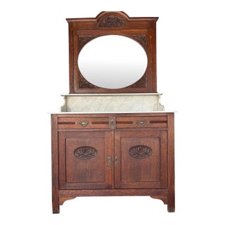 French Antique Oak Washstand / Vanity With a Marble Top, Oval Beveled Mirror, and Floral Carvings For Sale