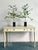 Presenting a delightful pair of vintage Hollywood Regency tole lemon trees, exuding an air of sophisticated whimsy and...