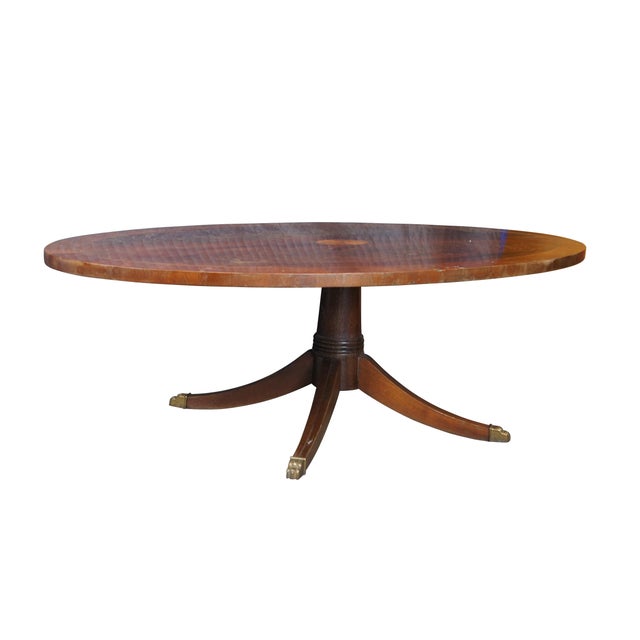 Vintage Hekman Furniture oval coffee or cocktail table featuring English Georgian styling with crotch mahogany top and...