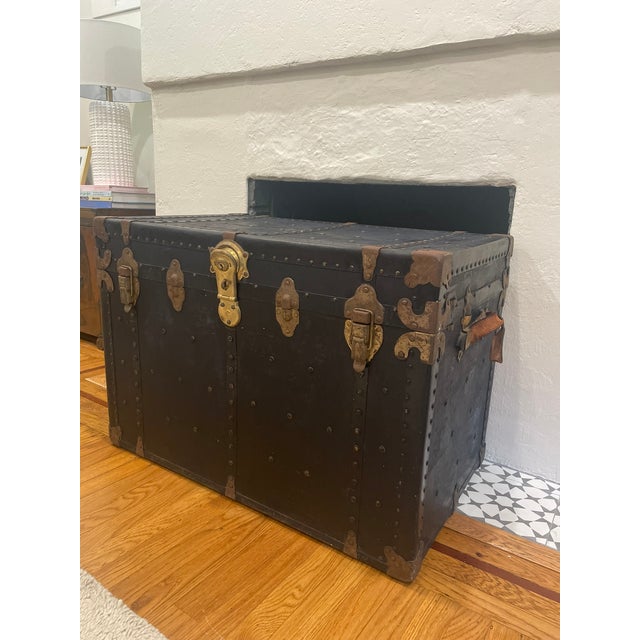 Spectacular piece of Americana, this early 20th-century flat-top cabin steamer trunk blends rugged industrial utility with...