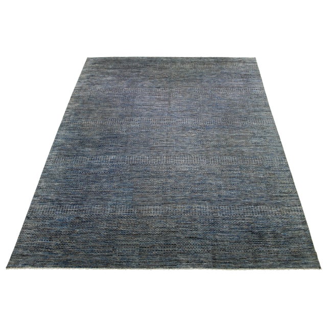 This beautiful hand-knotted Savannah wool rug features a stunning contemporary design, showcasing a meticulously crafted...
