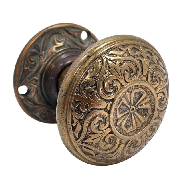 Add a rare piece of American hardware to your favorite door with this ornamental and solid American bronze door knob of...