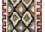 A bold mid-20th century Navajo rug with an all-over diamond pattern woven in black, white, and brown wool surrounded by a...