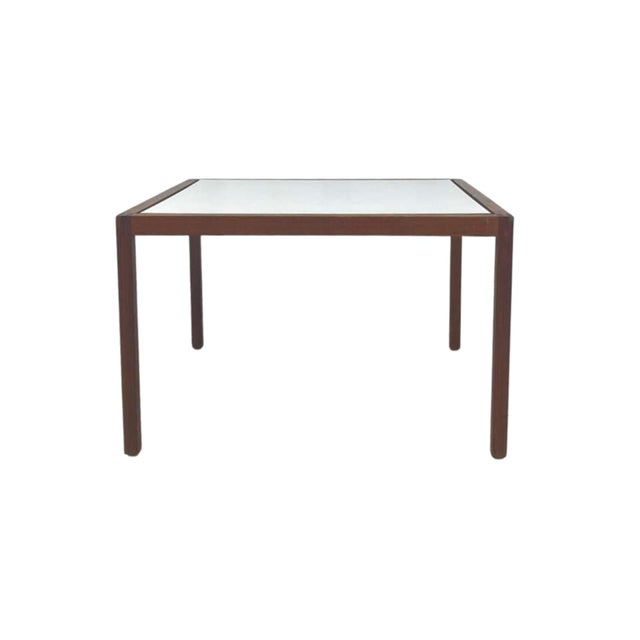 This Knoll walnut and laminate side table showcases the refined simplicity of mid‑century modern design. Crafted with a...