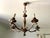 Five-light bronze chandelier with floral shades and botanical details on the branches. Classic and understated. E14...