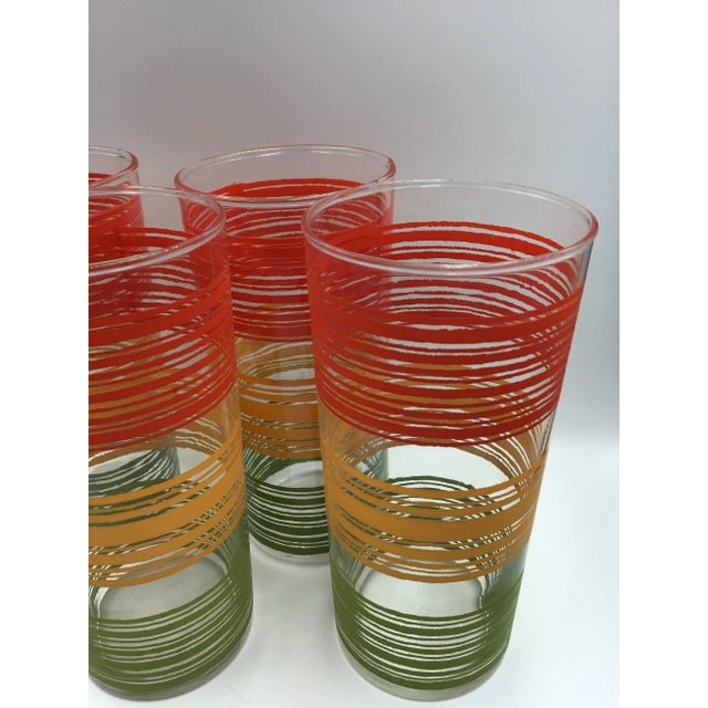 Fantastic 60s striped bar glasses in excellent condition. They measure 6” H and 2 3/4” W.