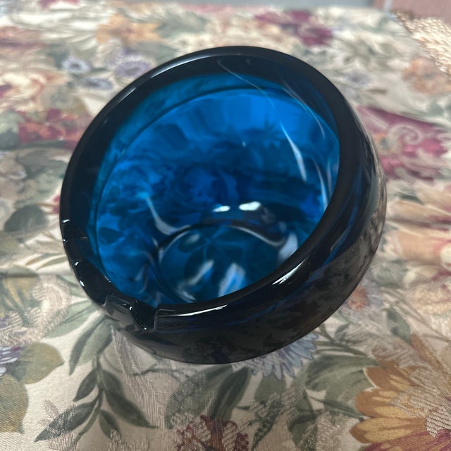 This is a vintage Viking Glass Orb Ashtray in a deep cobalt blue color, sometimes referred to as "Bluenique". It is a...