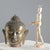 Bronze head of Buddha depicted in a meditative expression, with thick curly hair gathered in an 'ushnisha' on the crown of...