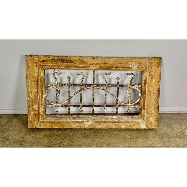 19th century panel made of a wood frame with hand wrought iron inset. Beautiful distressed paint throughout. It would be...