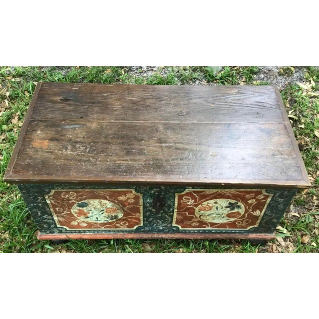 19th Century European painted trunk with original painted surface. There is exposed dovetail construction. Original iron...