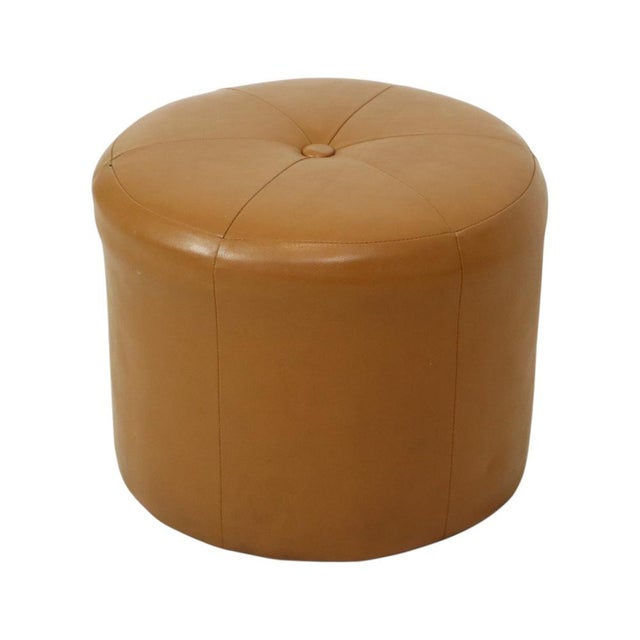 Cool round vintage pouf in patchwork style, made from a wooden base and upholstered in high-quality camel brown faux...