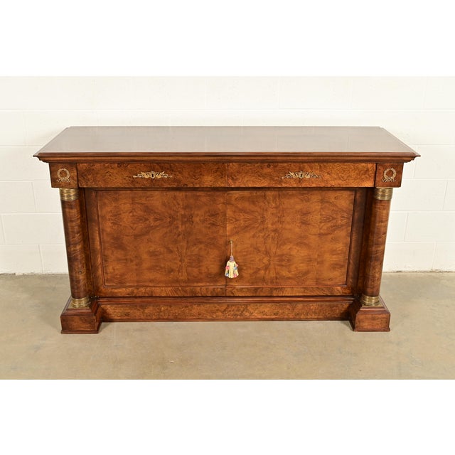 A gorgeous French Empire or French Regency Louis XVI style sideboard, credenza, or bar cabinet In the manner of Baker...