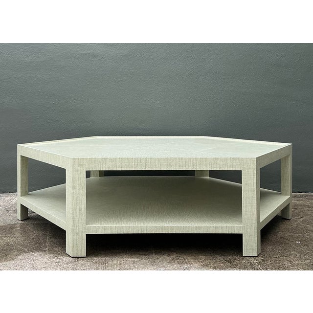 Anchor your living space with the sophisticated architectural presence of this monumental Thibaut hexagon coffee table. A...