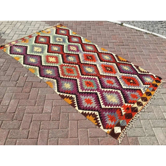 This beautiful, vintage, handwoven Kilim is approximately 60 years old. It is handmade of very fine quality, hand-spun...