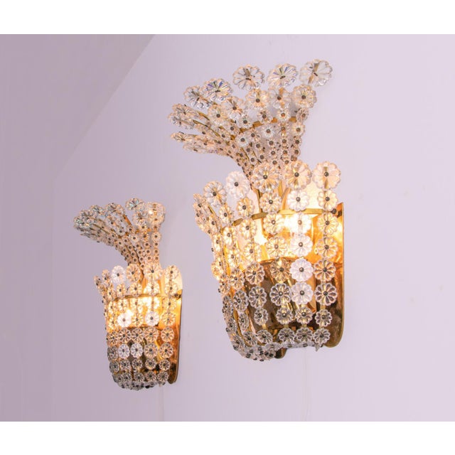 Charming pair of wall sconces with crystal flowers on a brass frame. Measures: height 9.8" in. (25 cm), width 7.9" in....