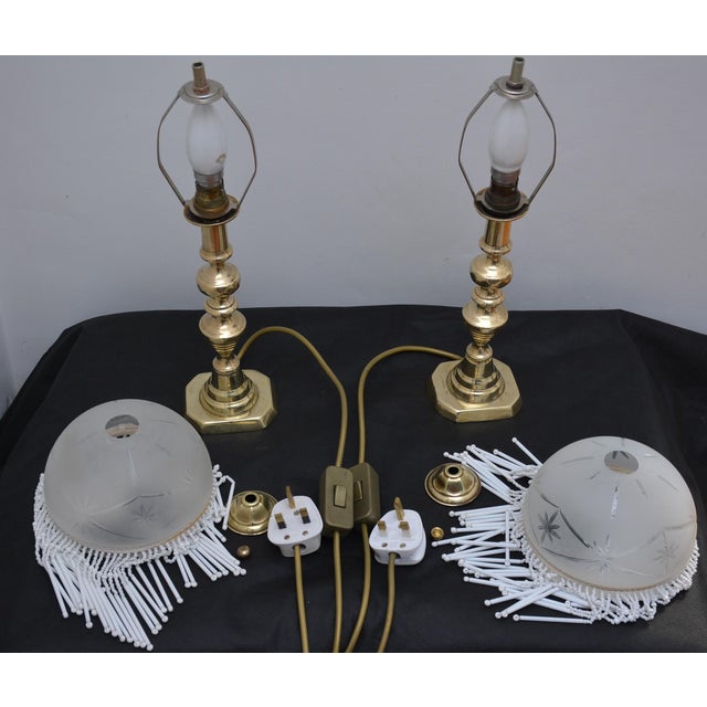 K0652 very elegant pair of antique victorian brass table lamps of turned form with canted bases. Each shade in frosted...
