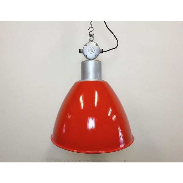 This Industrial pendant light was designed in the 1960s and produced by Elektrosvit in the former Czechoslovakia. It...