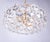 Elegant chandelier with sculptural faceted crystals on a gold-plated brass frame. Chandelier illuminates beautifully and...