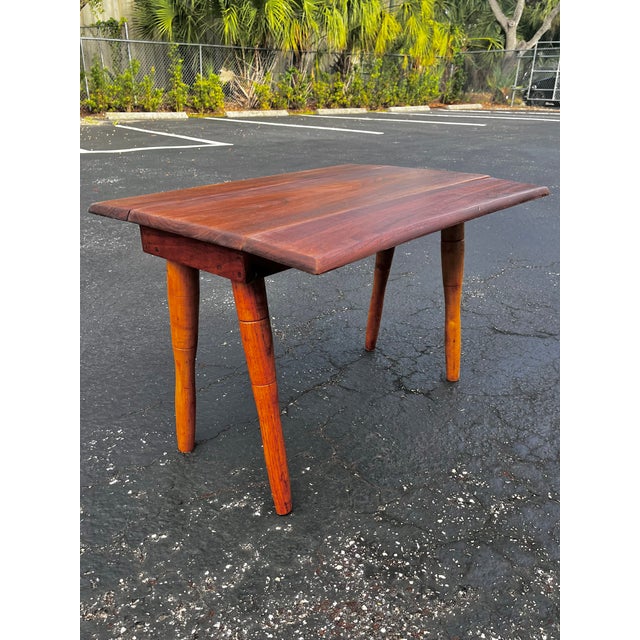 Mid-century modern fold-down coffee table. A simple design prefect for a quaint space. This table is versatile and can be...