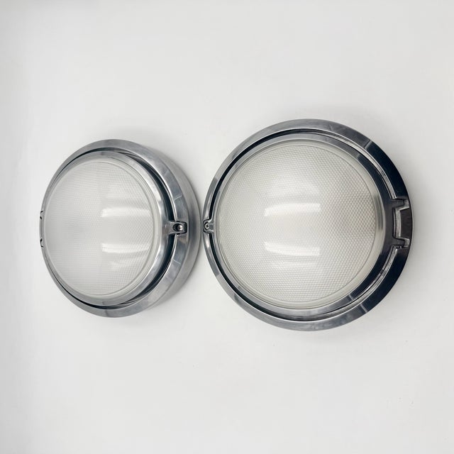 Designed by alberto meda and paolo rizzatto for luceplan, this matching pair of metropoli d20/27 flush mounts represents...