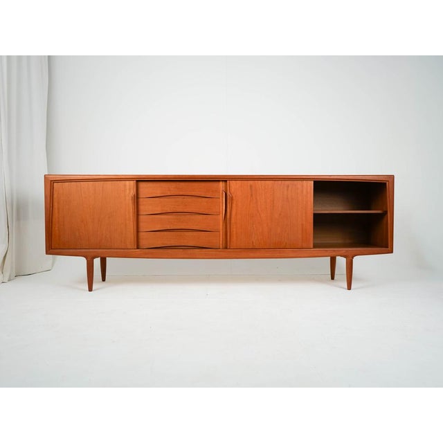 Mid-Century Teak Sideboard by Axel Christensen, 1960s, in Very Good conditions. Designed 1960 to 1969 This piece has an...