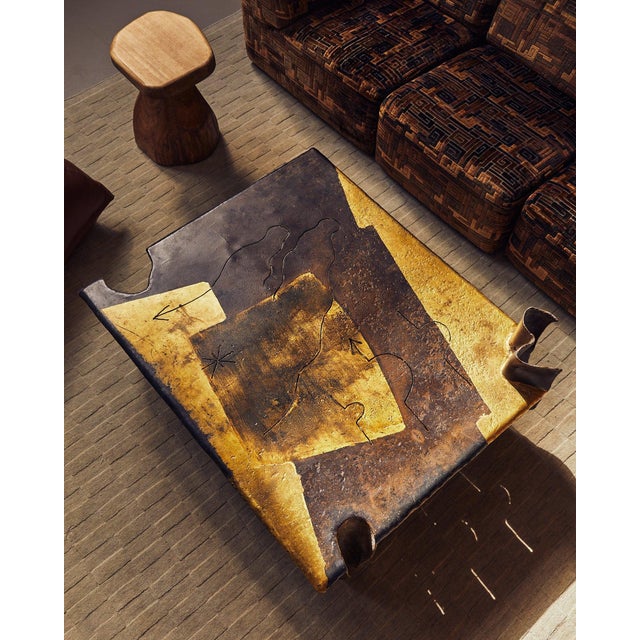 This French Brutalist coffee table Attributed to Jean-Jacques Argueyrolles rejects convention in favor of mythic geometry....