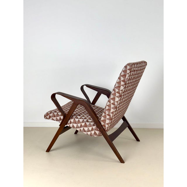 An armchair made by a renowned furniture company Tatra Nabytok in former Czechoslovakia, during the 1960's. Characteristic...