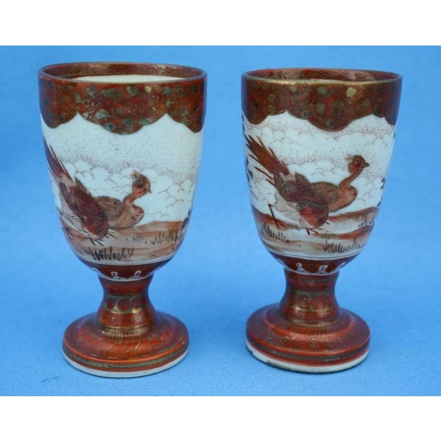 MEASUREMENTS: Height: 10 cm; Diameter: 5.3 cm; Weight: 0.179 kg Item : A refined and antique pair of sake glasses...