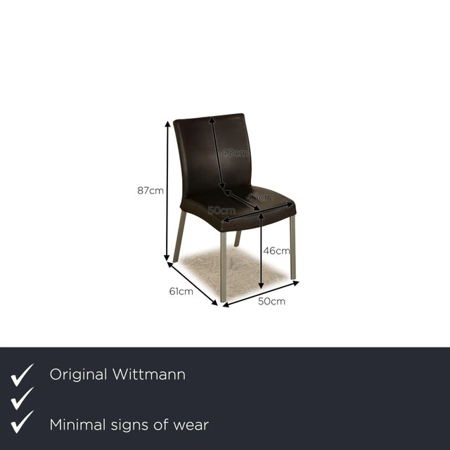 The Times chair set from Wittmann is covered in black genuine leather and stands on narrow metal feet. It is characterized...