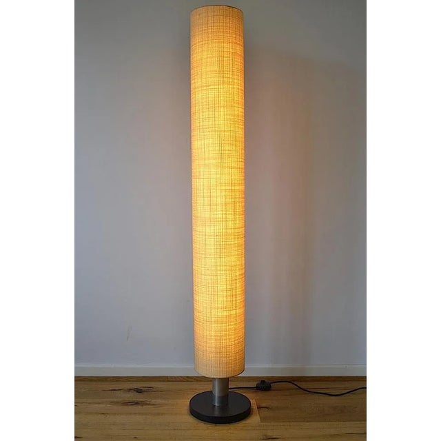 Very simple brutalist column lamp of the Dutch company Philips from the 1960s. The lamp consists of a round stand which is...