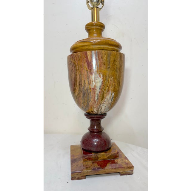 This large and heavy table lamp features a striking purple, brown, and green onyx stone base, giving it a unique and...