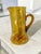 Crafted with meticulous care, this Vintage Italian Hand Blown Amber Art Glass Pitcher is a testament to the timeless...